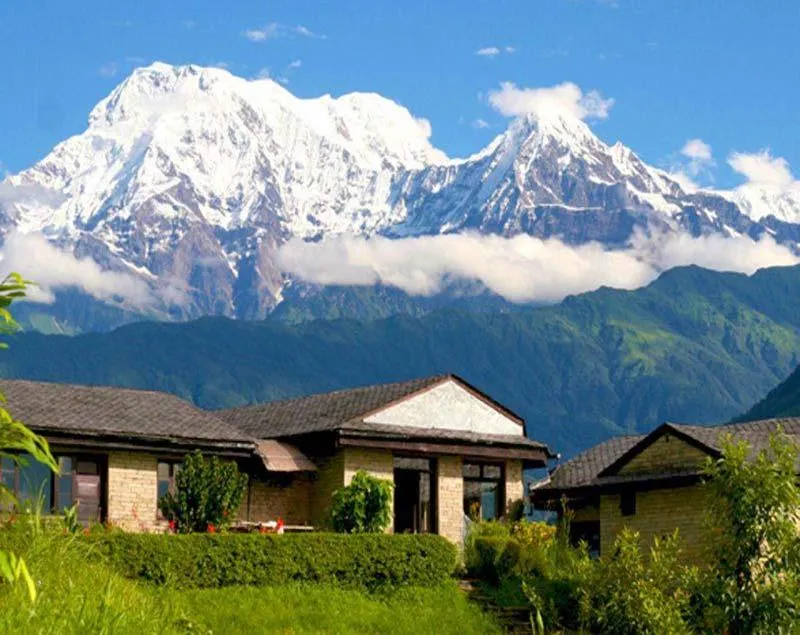 Annapurna Base Camp trek — mountain houses with the Annapurna range behind